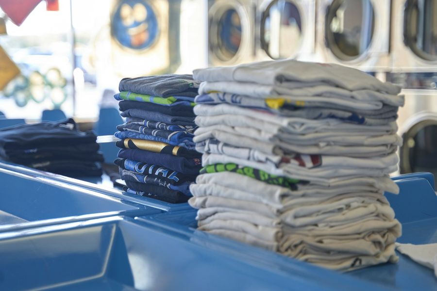 Stacks of freshly folded shirts on a table